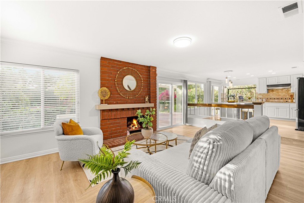 19 Alameda Irvine, CA 92620 - Photo 16 of 59 a living room with furniture and a floor to ceiling window