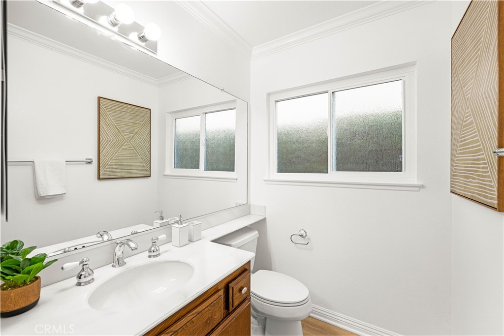 19 Alameda Irvine, CA 92620 - Photo 17 of 59 a bathroom with a sink mirror and toilet