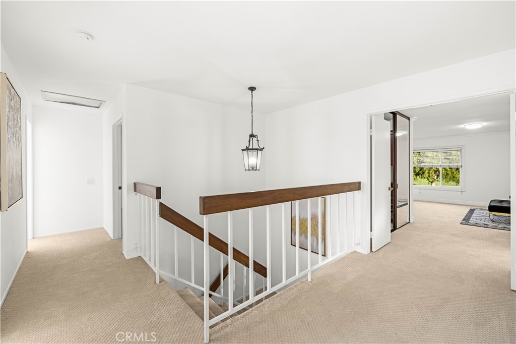 19 Alameda Irvine, CA 92620 - Photo 19 of 59 a view of a hallway with closet and stairs