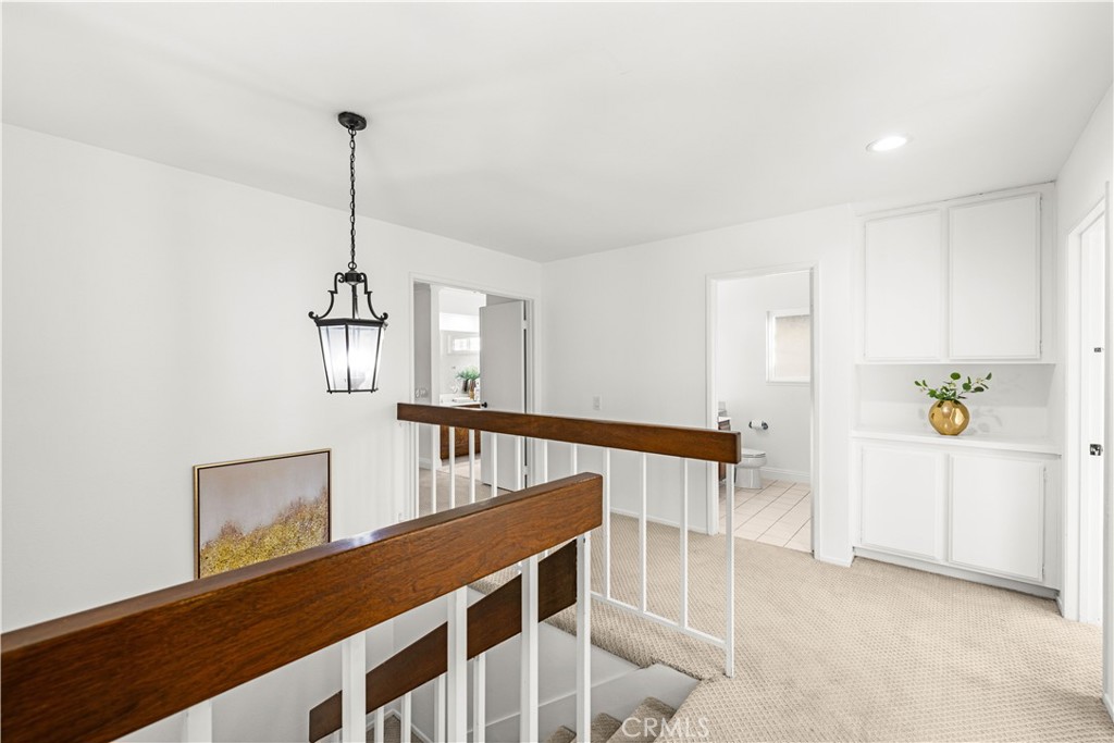 19 Alameda Irvine, CA 92620 - Photo 20 of 59 a view of entryway and hall with wooden floor