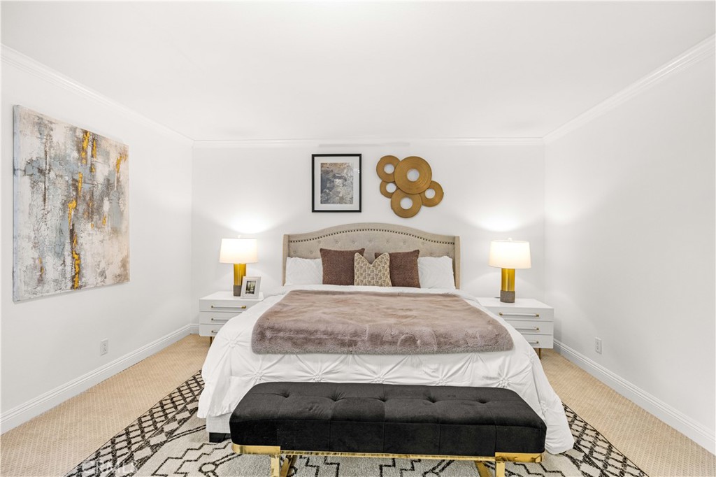 19 Alameda Irvine, CA 92620 - Photo 22 of 59 a bedroom with a bed and painting on the wall