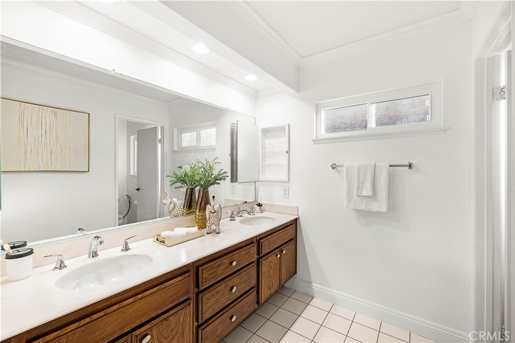 19 Alameda Irvine, CA 92620 - Photo 24 of 59 a bathroom with a double vanity sink mirror and