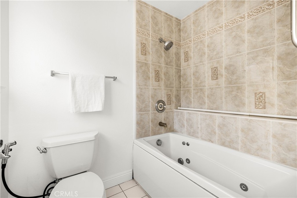 19 Alameda Irvine, CA 92620 - Photo 25 of 59 a bathroom with a toilet bathtub and shower
