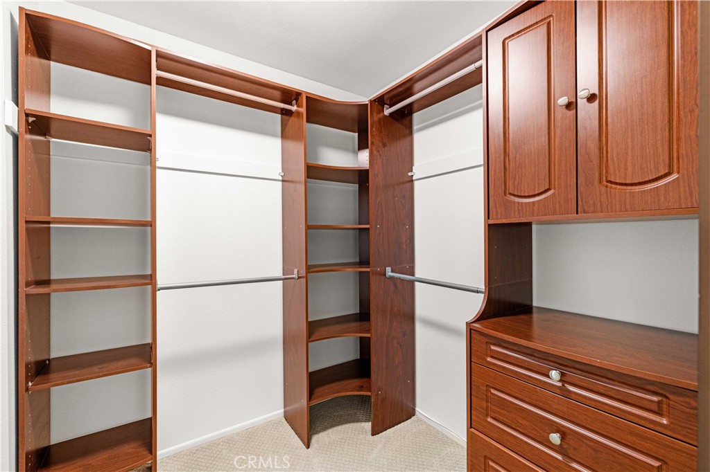 19 Alameda Irvine, CA 92620 - Photo 26 of 59 a kitchen with a refrigerator and cabinets