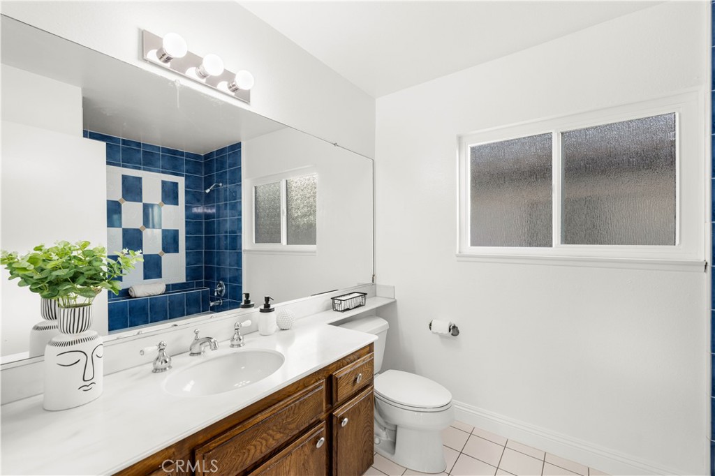 19 Alameda Irvine, CA 92620 - Photo 29 of 59 a bathroom with a sink and a mirror