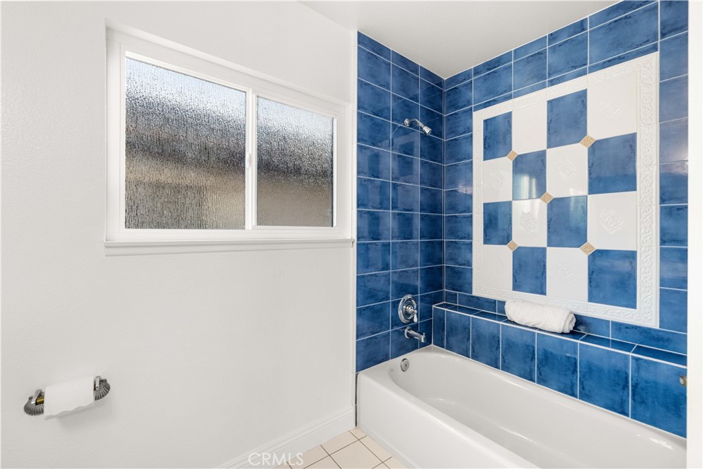 19 Alameda Irvine, CA 92620 - Photo 30 of 59 a bathroom with a bathtub and a shower