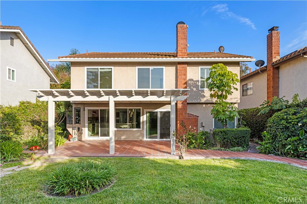 19 Alameda Irvine, CA 92620 - Photo 37 of 59 a view of a house with a backyard patio and a garden