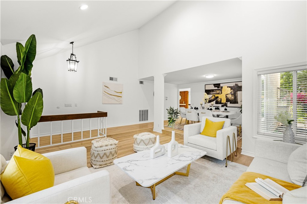19 Alameda Irvine, CA 92620 - Photo 4 of 59 a living room with furniture potted plant and a large window