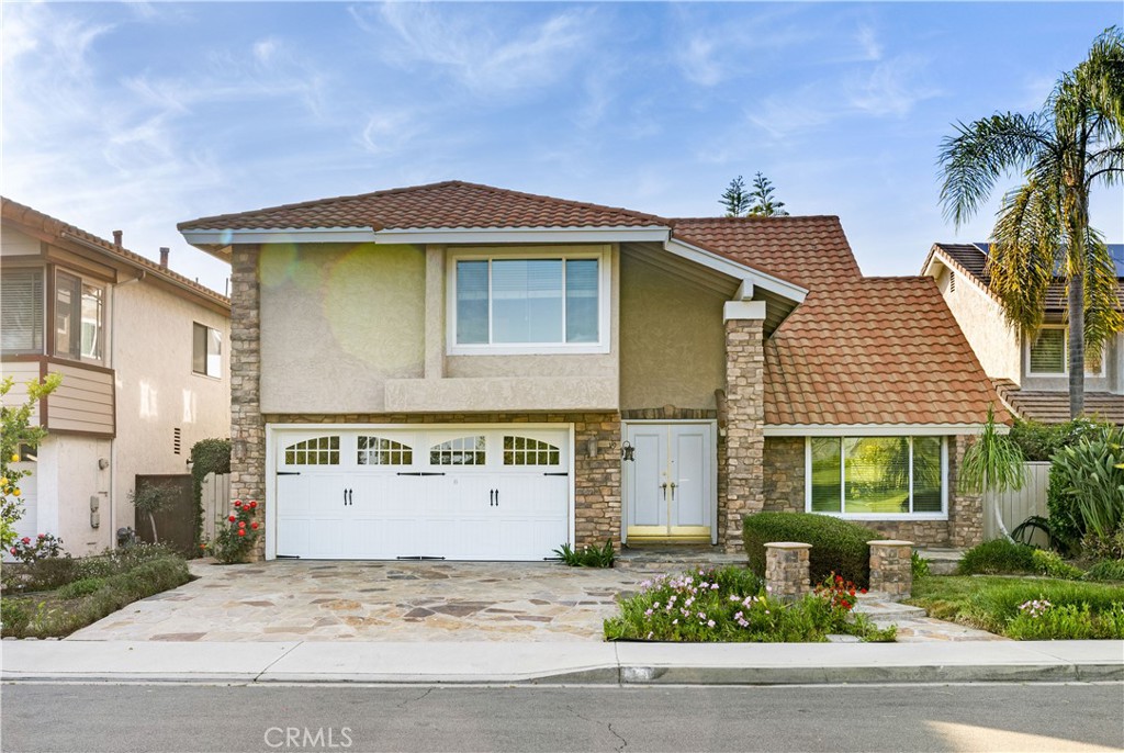 19 Alameda Irvine, CA 92620 - Photo 45 of 59 front view of a house with a yard