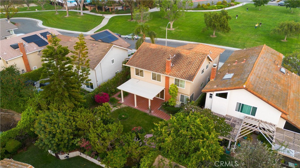 19 Alameda Irvine, CA 92620 - Photo 50 of 59 an aerial view of a house with a garden and lake view
