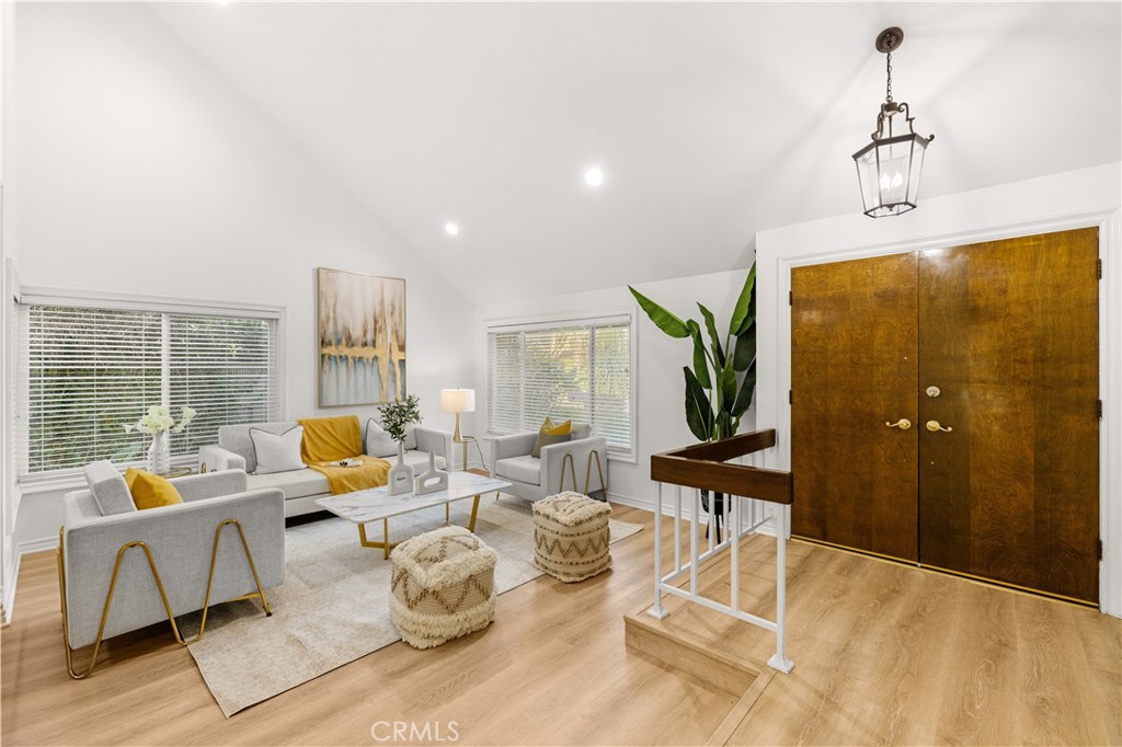 19 Alameda Irvine, CA 92620 - Photo 5 of 59 a living room with furniture and a table