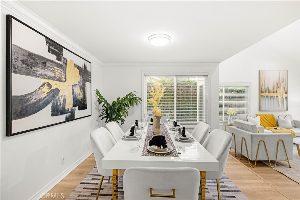 19 Alameda Irvine, CA 92620 - Photo 8 of 59 a view of a dining room with furniture large windows and wooden floor