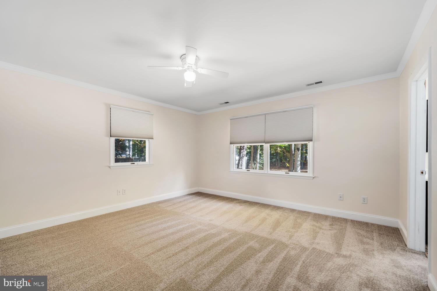 29202 Holly Road Easton, MD 21601 - Photo 21 of 34 a view of an empty room with a window
