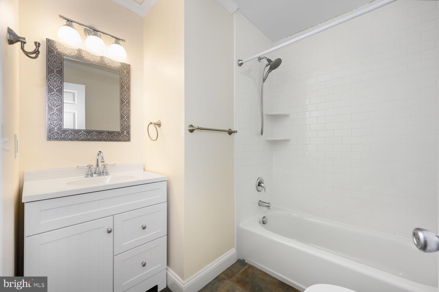 29202 Holly Road Easton, MD 21601 - Photo 29 of 34 a bathroom with a tub sink toilet and mirror