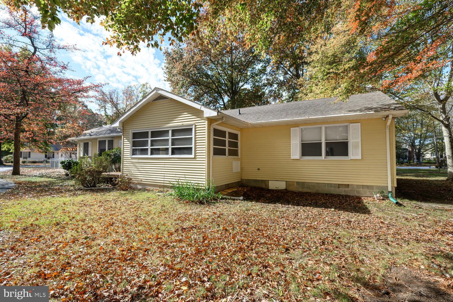 29202 Holly Road Easton, MD 21601 - Photo 8 of 34 a front view of a house with a yard