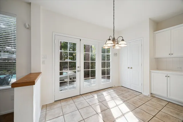 a view of kitchen with wooden floor and electronic appliances