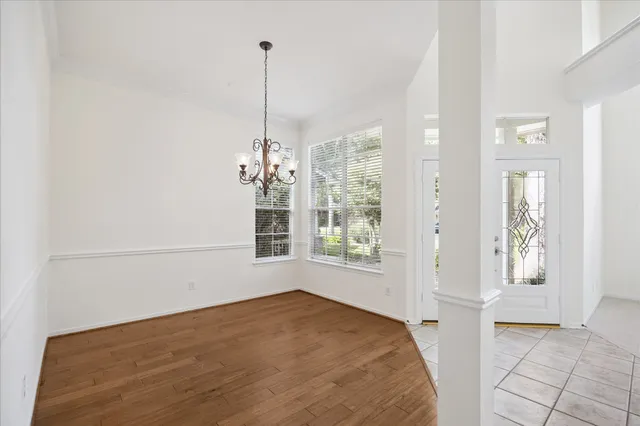 a view of empty room with windows