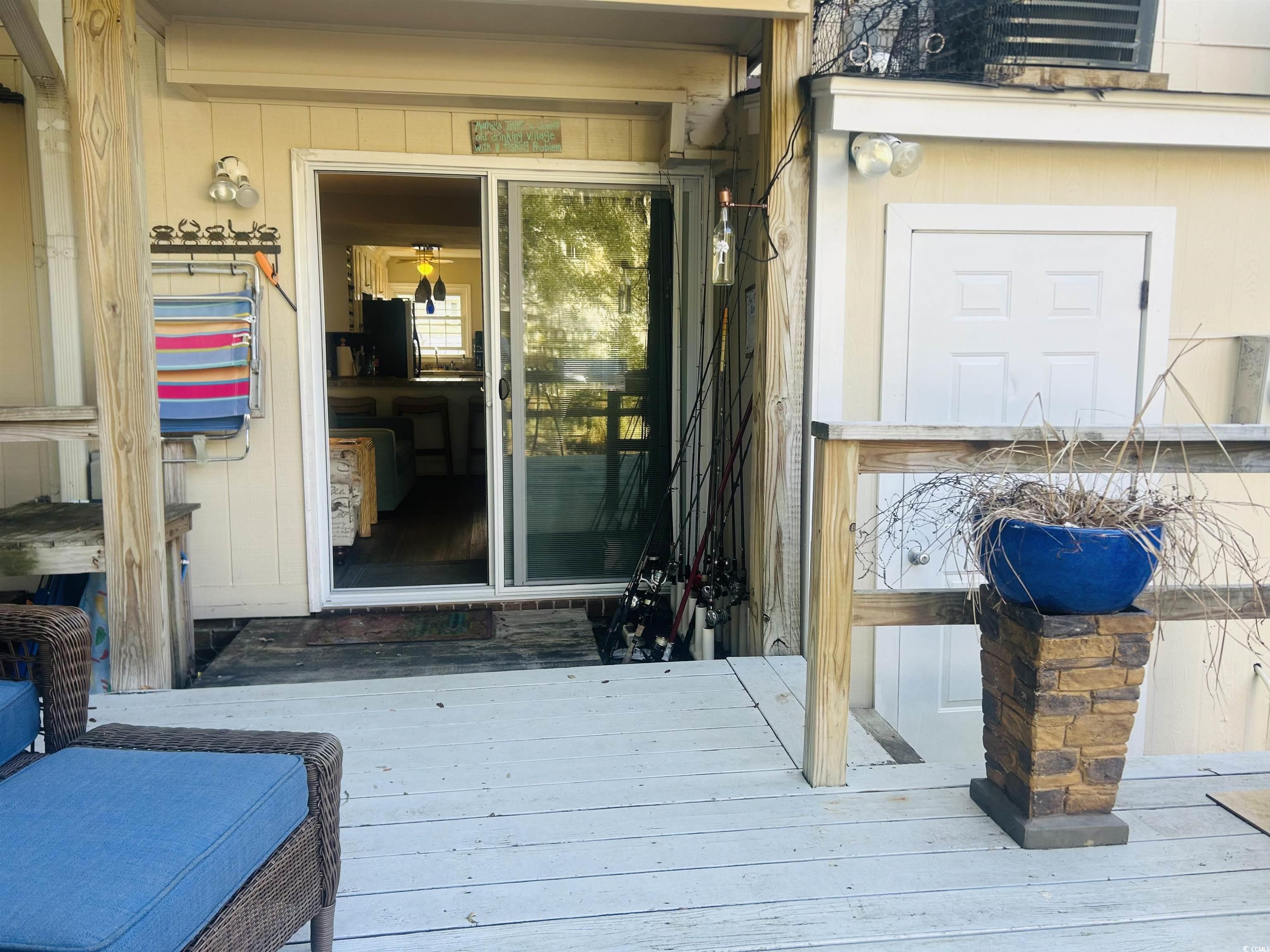 3866 Highway 17 Business, Unit C3 Murrells Inlet, SC 29576 - Photo 15 of 32 Back patio featuring a wooden deck