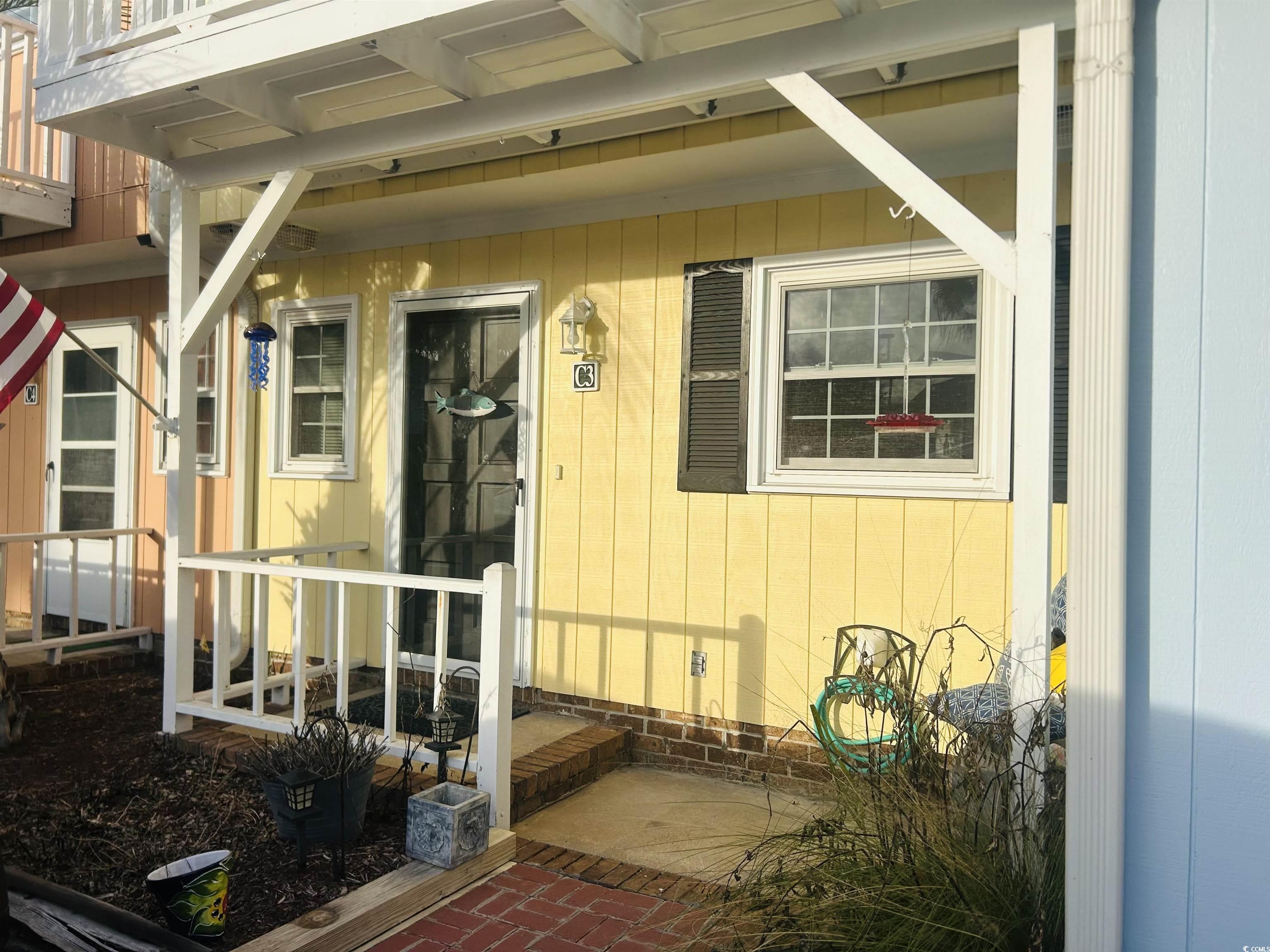 3866 Highway 17 Business, Unit C3 Murrells Inlet, SC 29576 - Photo 4 of 32 Entrance to property with a patio