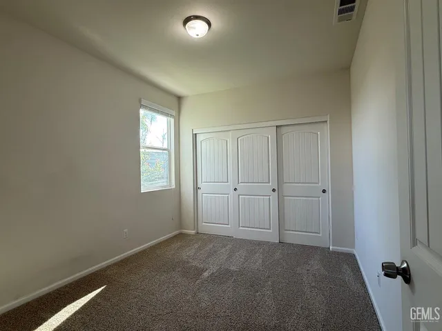 a view of a livingroom and a window