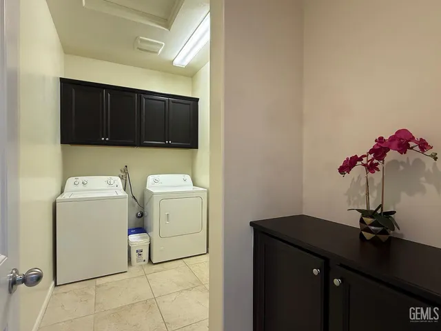 a view of storage and utility room with a sink