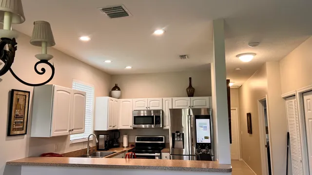 a view of living room with furniture and wooden floor