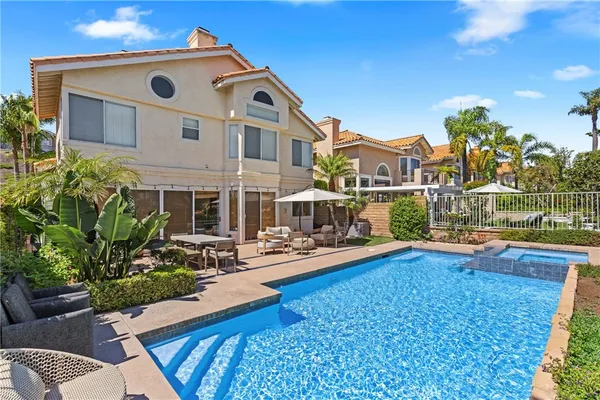 a front view of house with yard and seating space