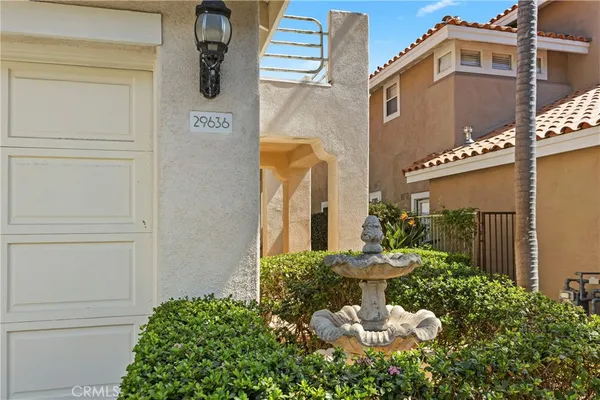 a potted plant sitting in front of a house