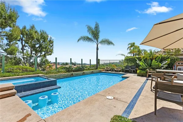 an outdoor space with furniture and umbrella