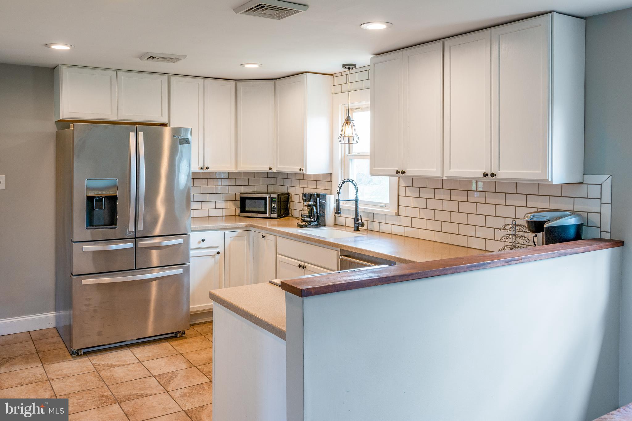 737 Rising Sun Road Telford, PA 18969 - Photo 6 of 21 a kitchen with stainless steel appliances granite countertop a sink a stove and a refrigerator
