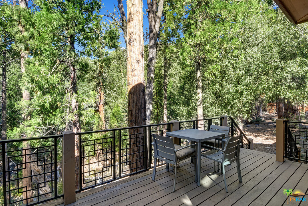 25445 Fern Valley Road Idyllwild, CA 92549 - Photo 12 of 52 a view of balcony with furniture and wooden floor
