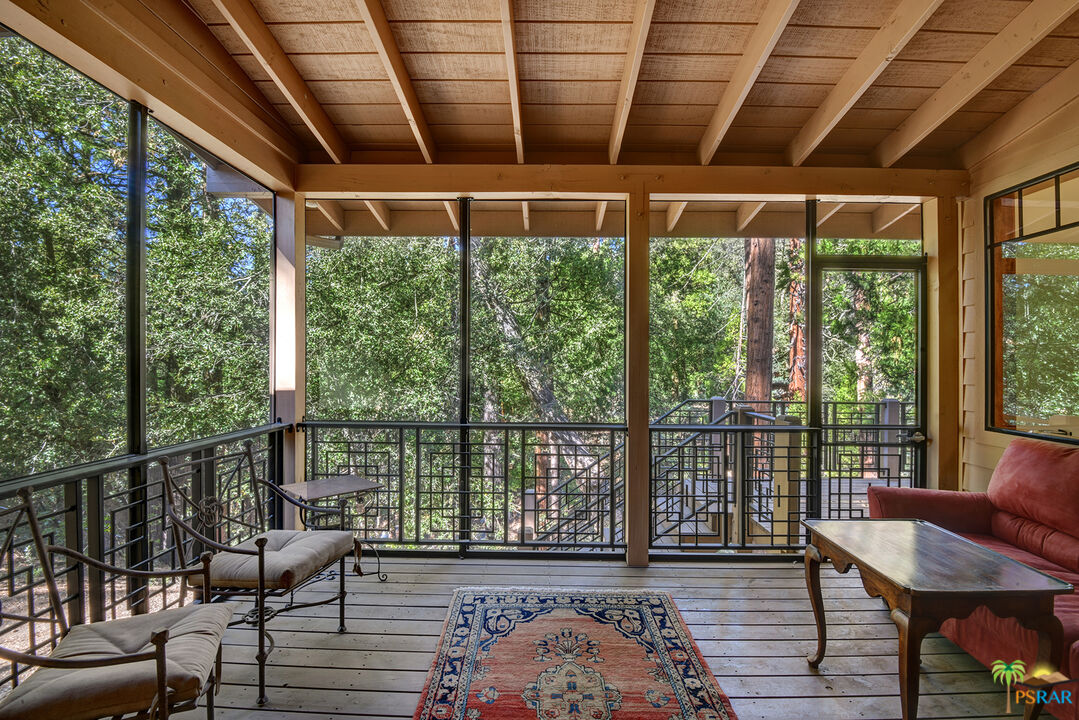 25445 Fern Valley Road Idyllwild, CA 92549 - Photo 13 of 52 a bedroom with furniture and a large window