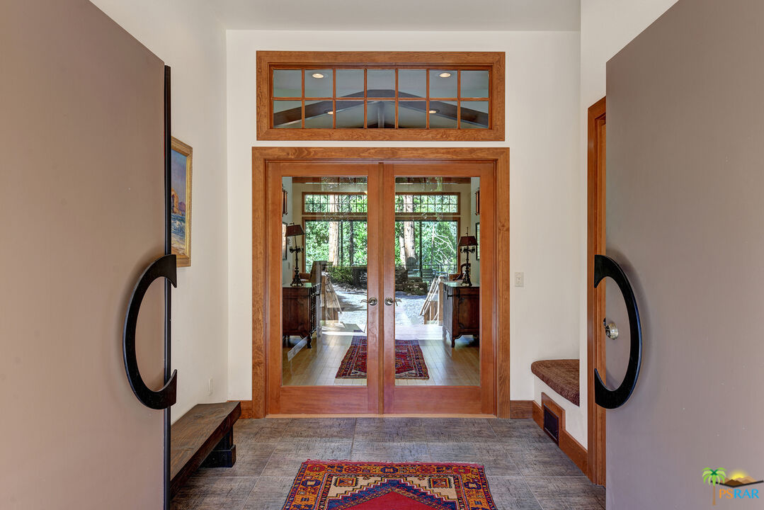 25445 Fern Valley Road Idyllwild, CA 92549 - Photo 15 of 52 a view of a hallway with washer and dryer