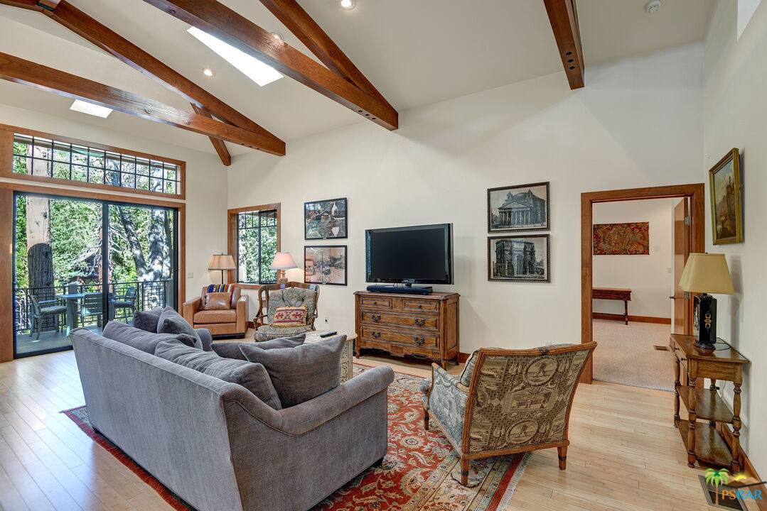 25445 Fern Valley Road Idyllwild, CA 92549 - Photo 17 of 52 a living room with furniture and a flat screen tv