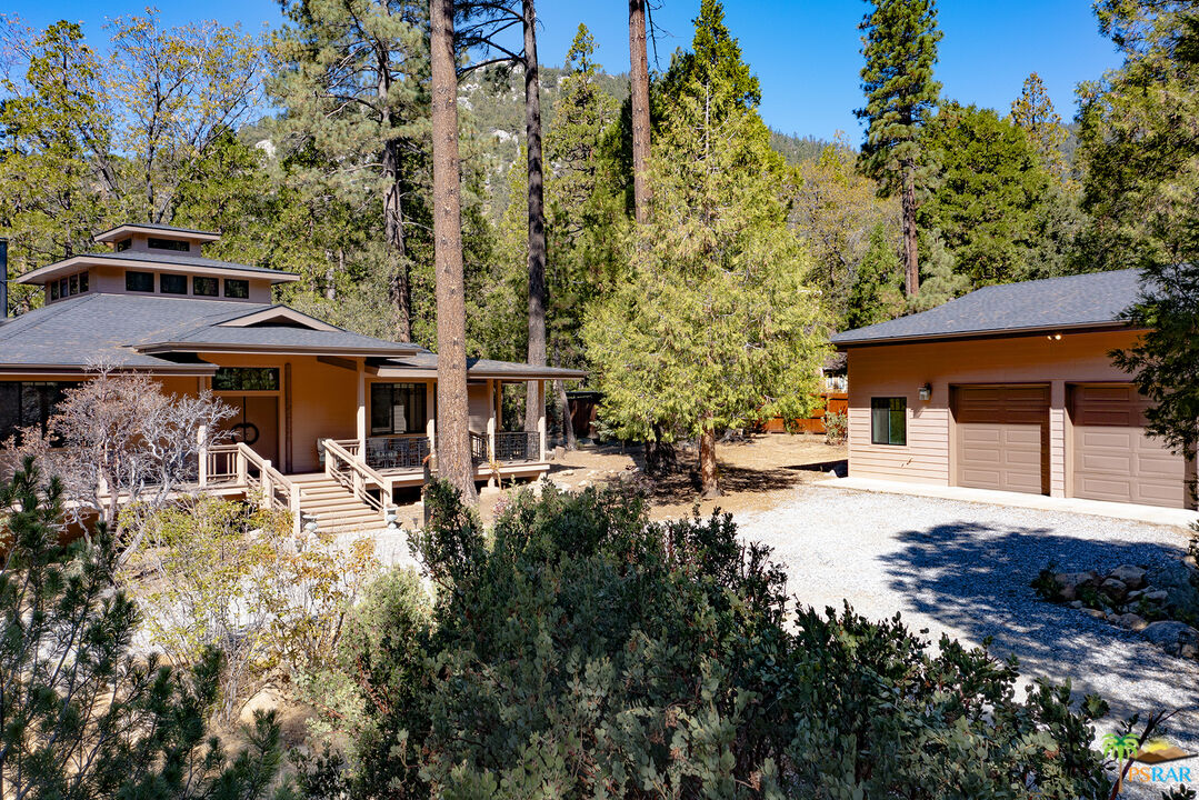 25445 Fern Valley Road Idyllwild, CA 92549 - Photo 2 of 52 a view of a house with a yard and sitting area