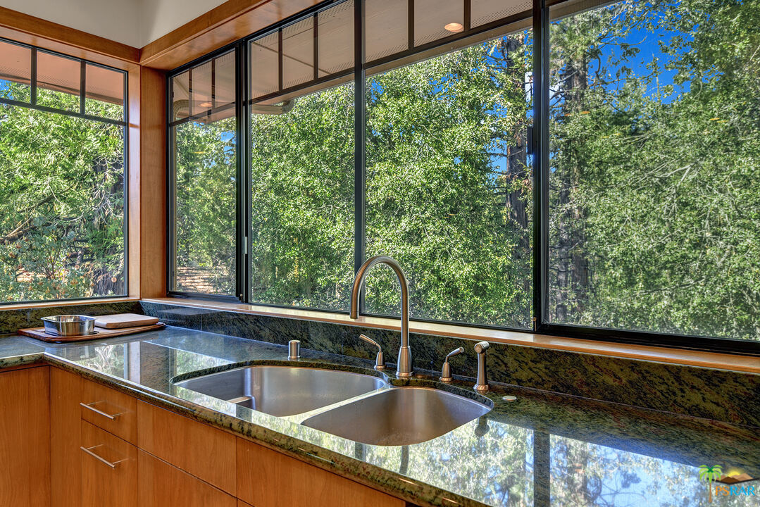 25445 Fern Valley Road Idyllwild, CA 92549 - Photo 26 of 52 a kitchen sink sitting next to a window