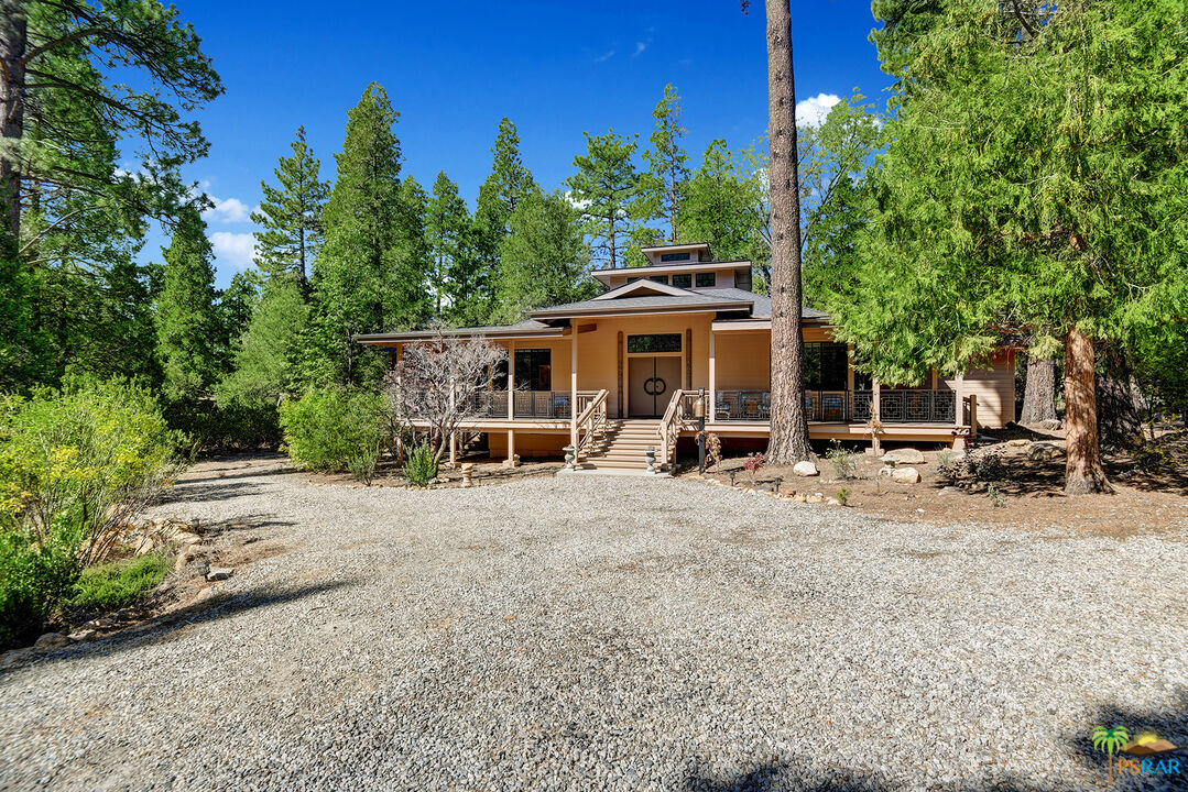 25445 Fern Valley Road Idyllwild, CA 92549 - Photo 3 of 52 a view of a house with backyard and sitting area
