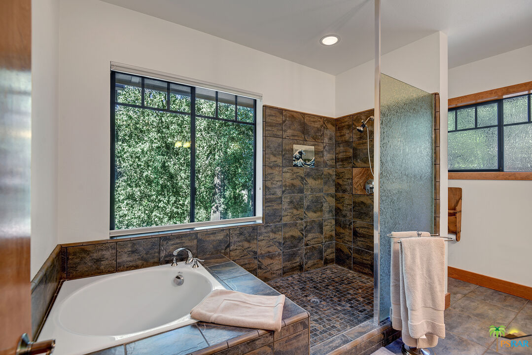 25445 Fern Valley Road Idyllwild, CA 92549 - Photo 35 of 52 a bathroom with a bathtub and a shower