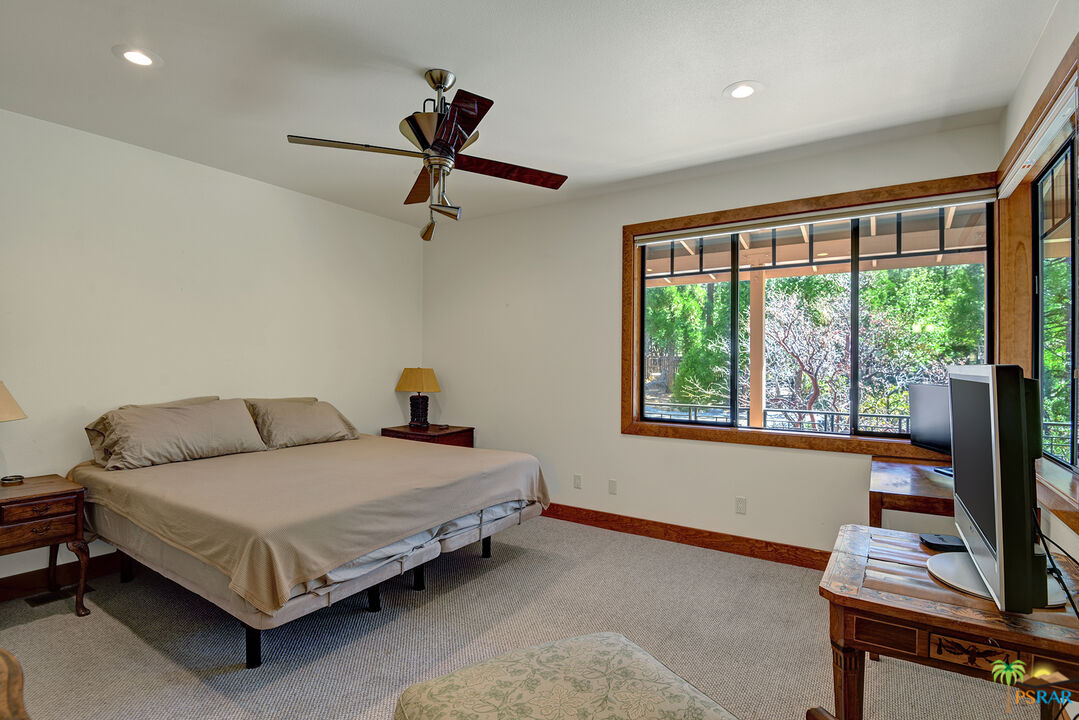 25445 Fern Valley Road Idyllwild, CA 92549 - Photo 38 of 52 a bedroom with a bed and a window