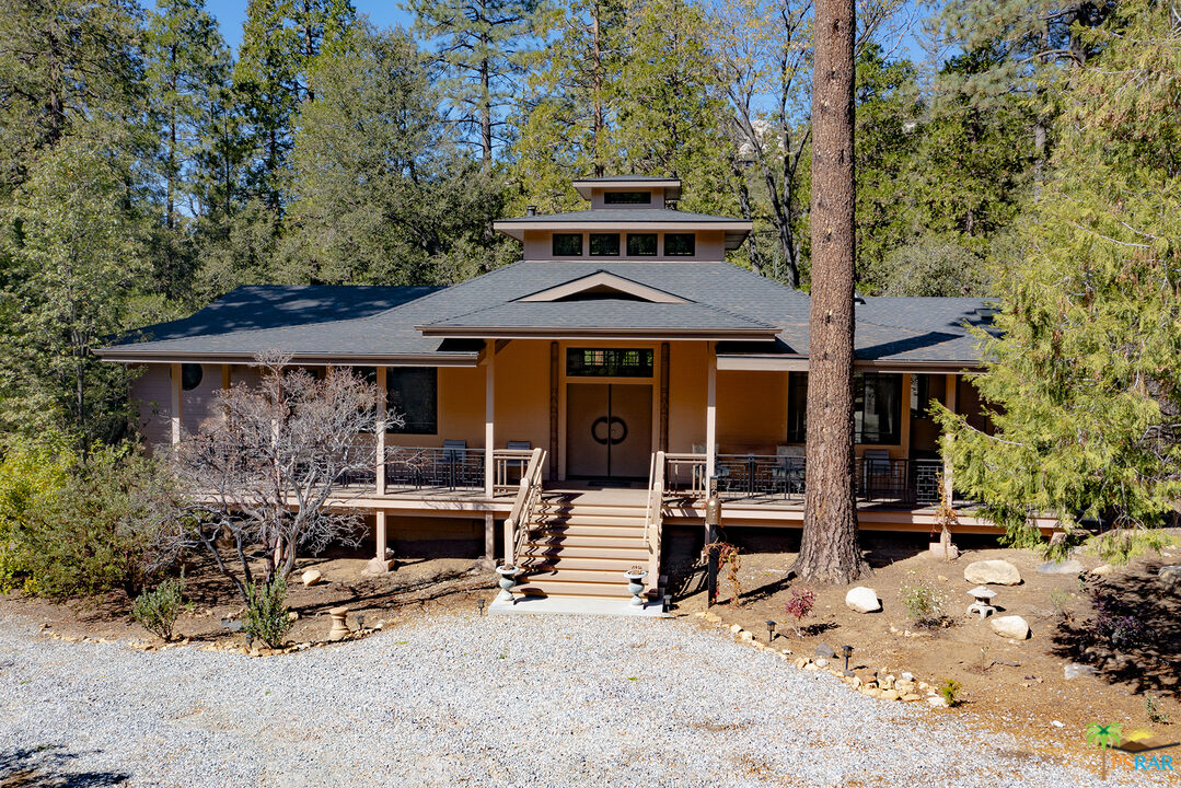 25445 Fern Valley Road Idyllwild, CA 92549 - Photo 4 of 52 a front view of a house with patio