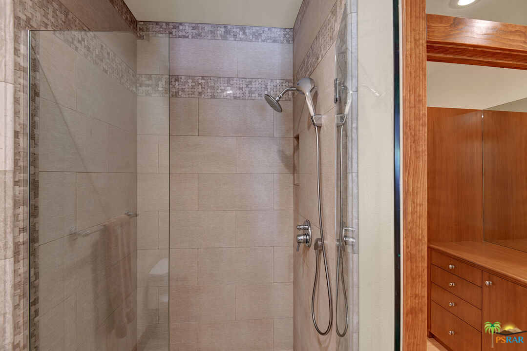 25445 Fern Valley Road Idyllwild, CA 92549 - Photo 42 of 52 a bathroom with a glass shower door