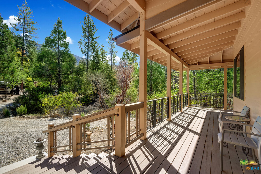25445 Fern Valley Road Idyllwild, CA 92549 - Photo 8 of 52 a view of balcony with wooden floor and fence