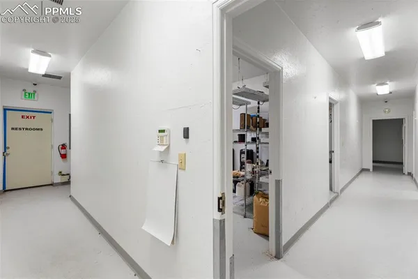 a utility room with dryer and baby