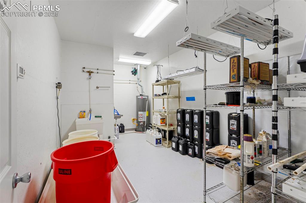 6040 Big Sky Drive Rye, CO 81069 - Photo 22 of 50 a storage room with lots of chairs a washer and dryer