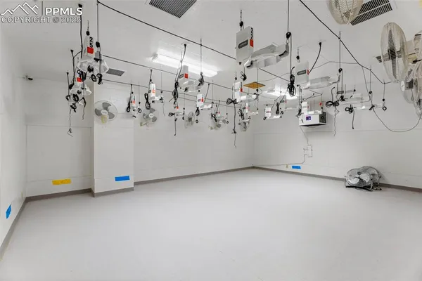 a view of a white kitchen with a white umbrella