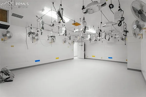 a bedroom with a bed and a tv