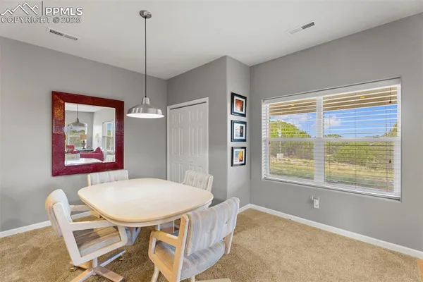 a view of a livingroom with furniture window and wooden floor
