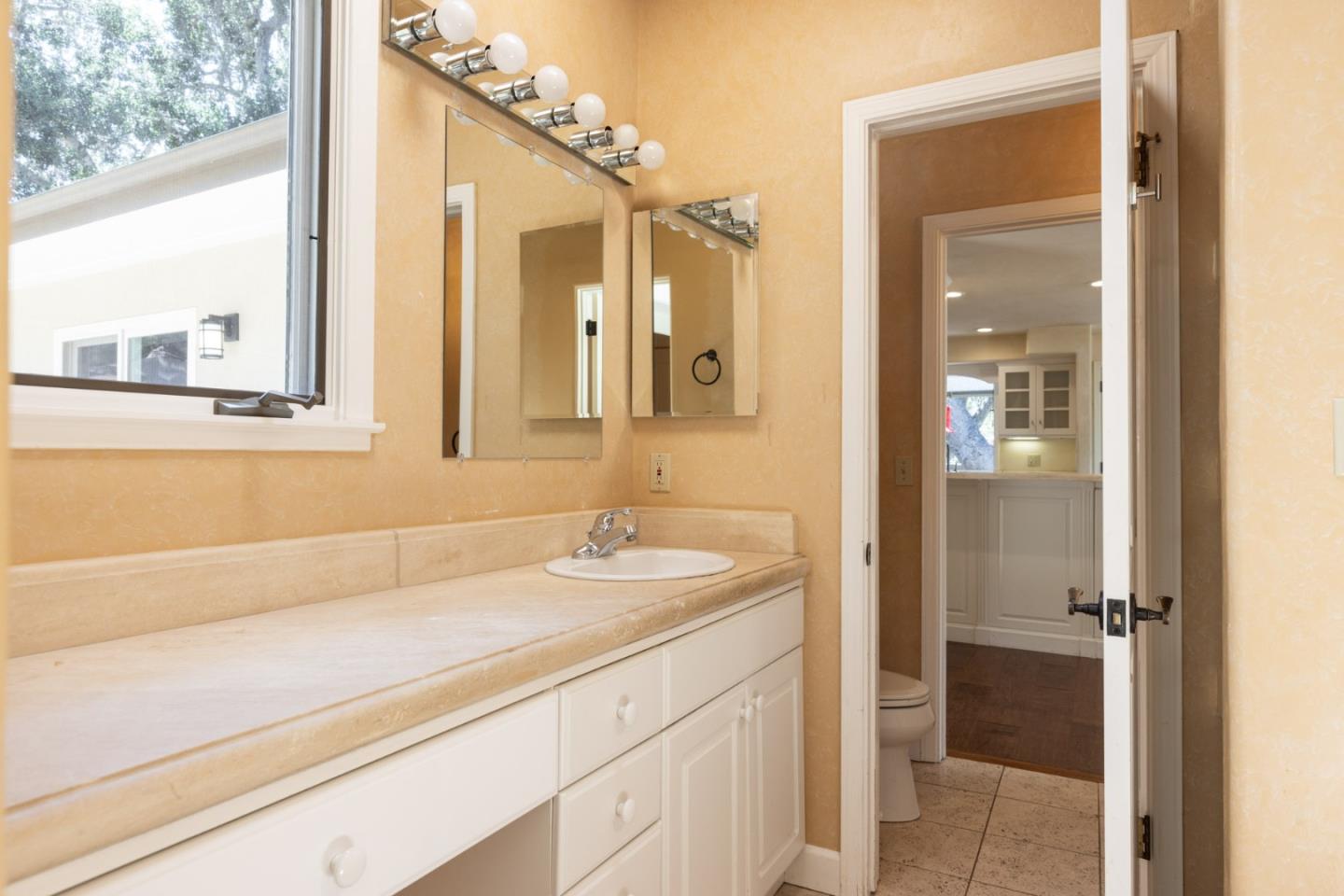 21 La Rancheria Carmel Valley, CA 93924 - Photo 12 of 44 a bathroom with a sink and a mirror