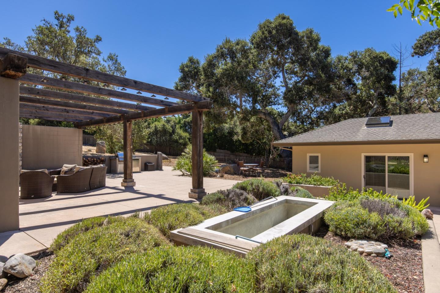21 La Rancheria Carmel Valley, CA 93924 - Photo 28 of 44 a view of a backyard with plants and a patio