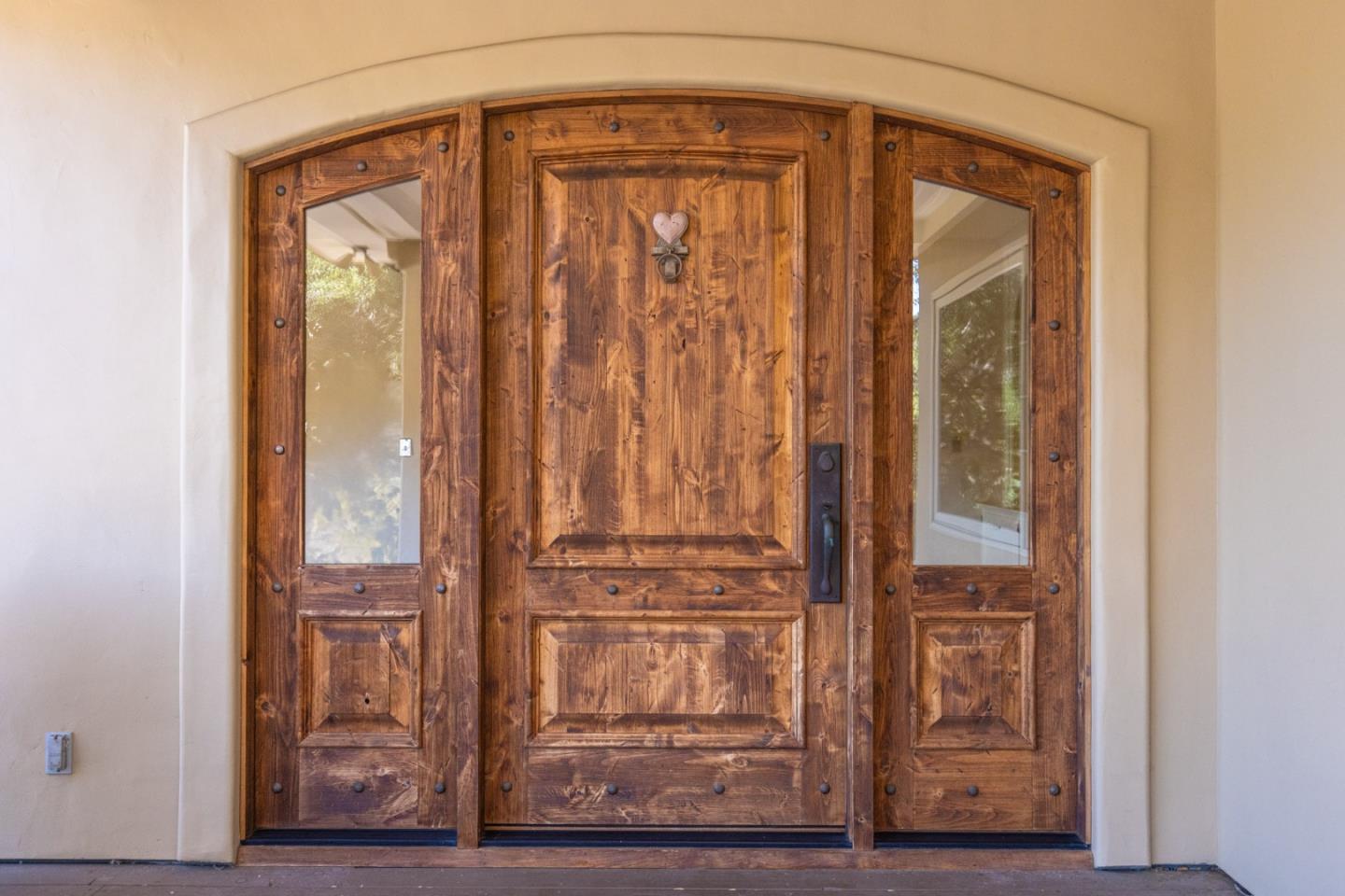 21 La Rancheria Carmel Valley, CA 93924 - Photo 4 of 44 a front view of a house with wooden floor
